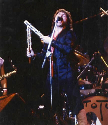 Bobby Kimbal Bobby Kimbal singing passionately and playing two jesticks